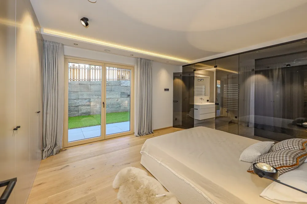 KITZIMMO-Luxuriöse Gartenwohnung mit eigenem Wellnessbereich - Immobilien Brixen.