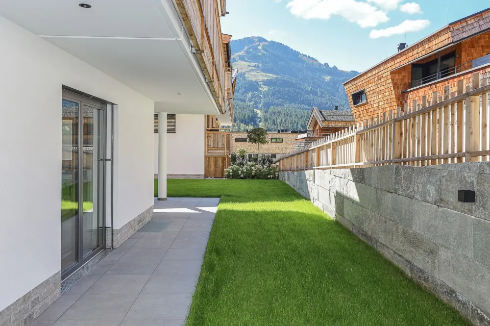 KITZIMMO-Luxuriöse Gartenwohnung mit eigenem Wellnessbereich - Immobilien Brixen.