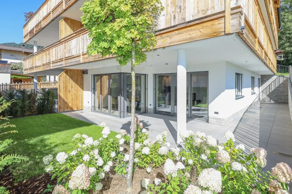 KITZIMMO-Luxuriöse Gartenwohnung mit eigenem Wellnessbereich - Immobilien Brixen.