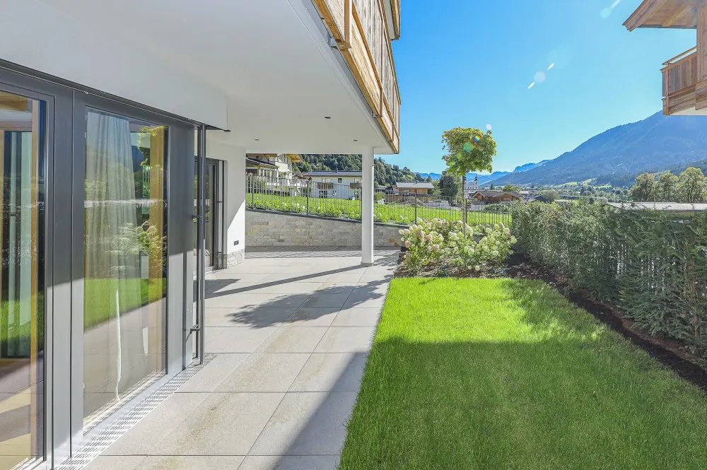 KITZIMMO-Luxuriöse Gartenwohnung mit eigenem Wellnessbereich - Immobilien Brixen.